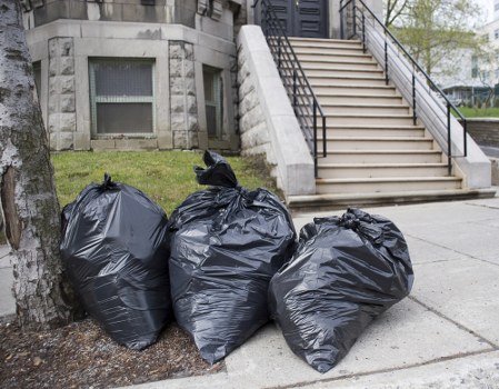 Workers wearing PPE during commercial waste handling