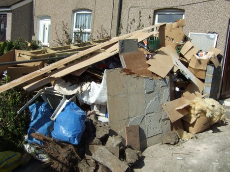 Various types of construction debris ready for disposal